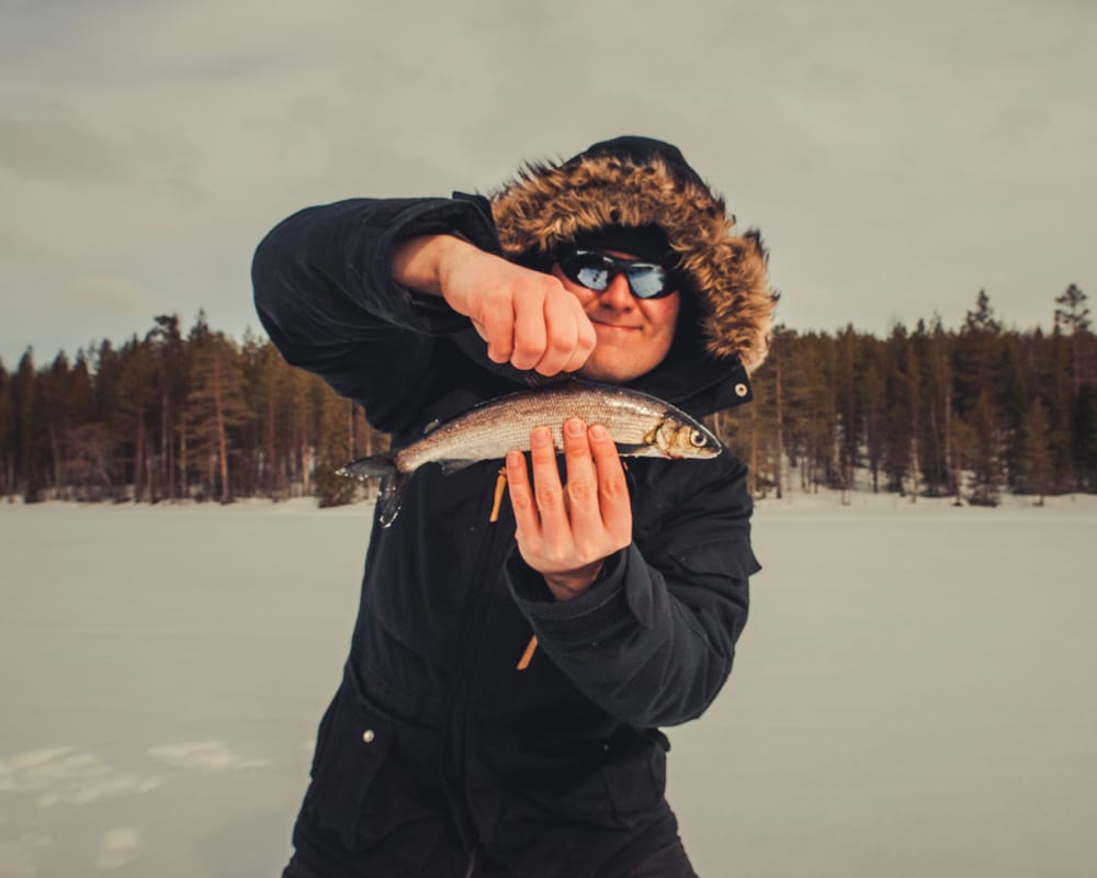 15.4.2020 Man catches whitefish with ice fishing.