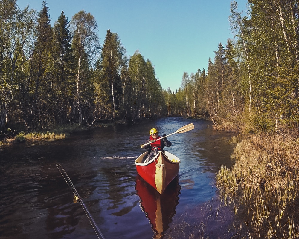 5.6.2021 Man canoeing in Finnish Lapland.