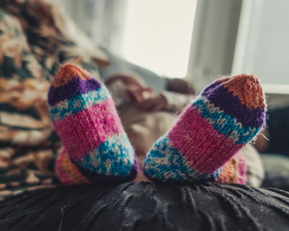 10.3.2022 tiny baby feet in wool socks