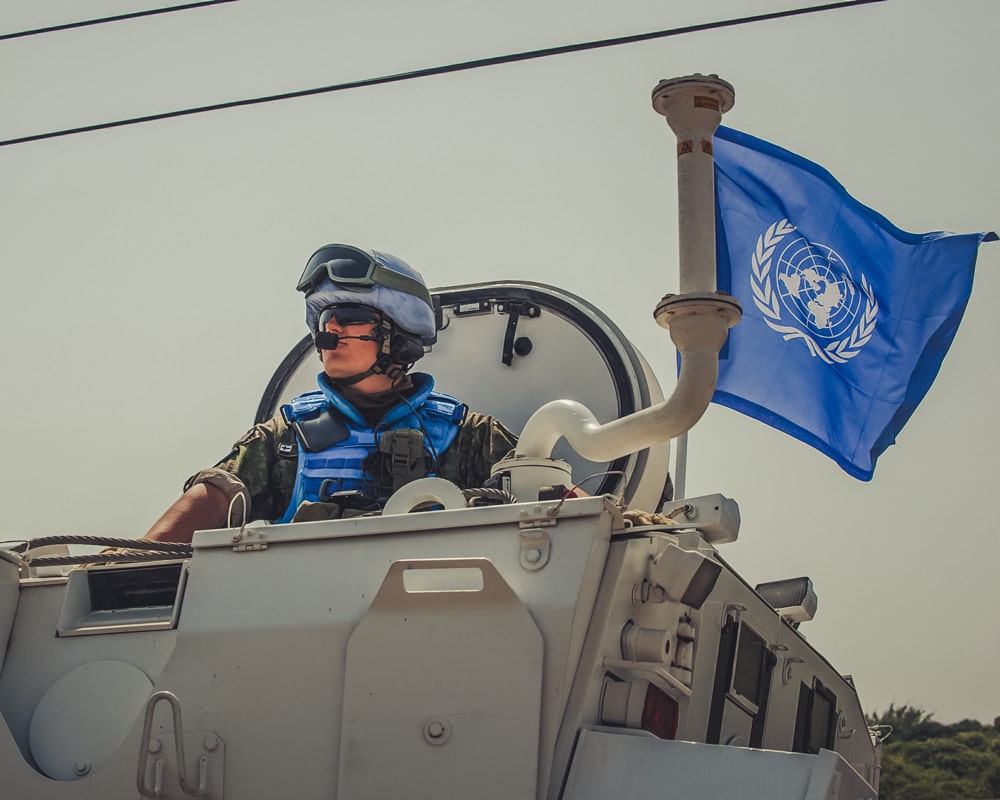 Soldier under the united nations flag