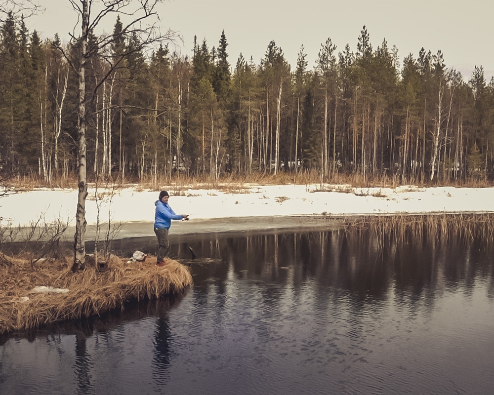 1.5.2022 Man fishing in Norvajoki, Rovaniemi Finland