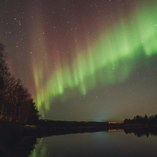 Northern Lights flicker in Rovaniemi, Lapland.