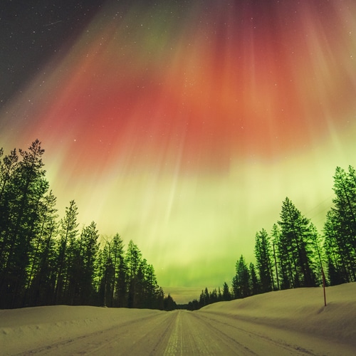 23.3.2023 Red Northern Lights above the road in Rovaniemi, Lapland.