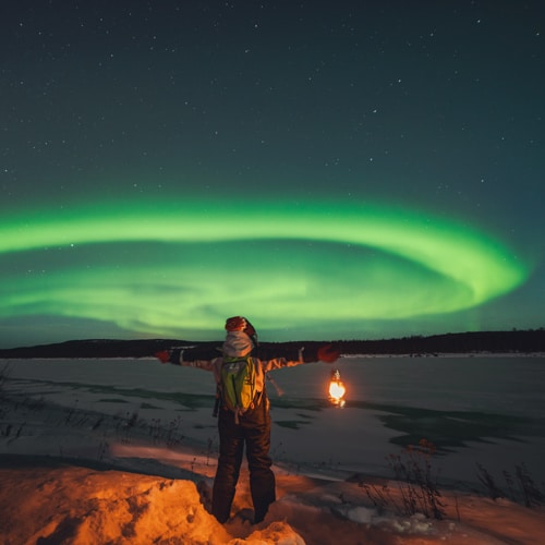 Standing under a twisting northern lights, Rovaniemi, Lapland.